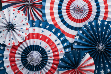 4th of July background. USA paper fans, Red, blue, white stars, balloons, gold confetti on gray...