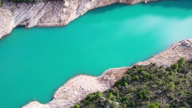 Panoramic beautiful vertiginous impressive aerial view of Montrebei gorge over Canelles reservoir, surrounded by vegetation on river in Catalonia, in Pyrenees, Spain.4K video. High quality 4k footage