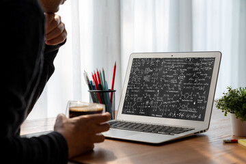 Mathematic equations and modish formula on computer screen showing concept of science and education