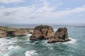 Pigeon Rock (Raouché), famous landmark of Beirut, natural landmark consisting of two rock formations off the coast of Raouché. - obrazy, fototapety, plakaty