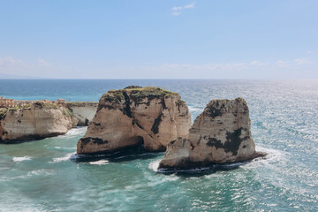 Naklejka premium Pigeon Rock (Raouché), famous landmark of Beirut, natural landmark consisting of two rock formations off the coast of Raouché.