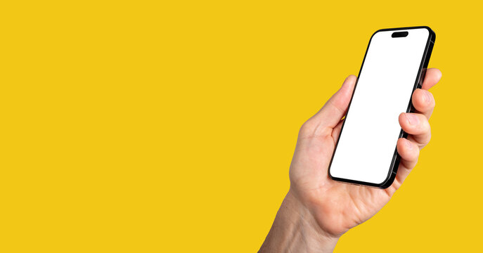 Lodz, Poland May 14 2023 hand holding iphone 14 pro phone mockup, screen mock-up. Yellow banner