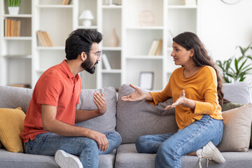 Couple Argue. Portrait Of Young Indian Man And Woman Arguing At Home