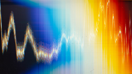Glitch glow. Color distortion noise. Old film texture. Blue orange white vibration artifacts dust scratches on black illustration abstract background.