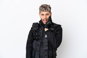 SWAT caucasian man isolated on white background surprised and shocked while looking right