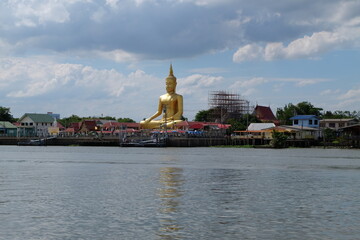Big Buddha statue in a riverside temple