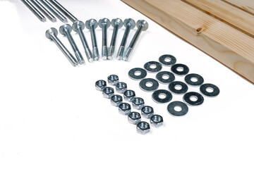 Close-up of screws with nuts and washers