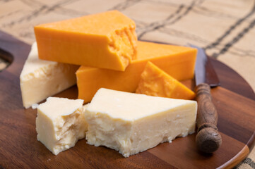 British cheeses collection, Scottish coloured and English matured cheddar cheeses close up