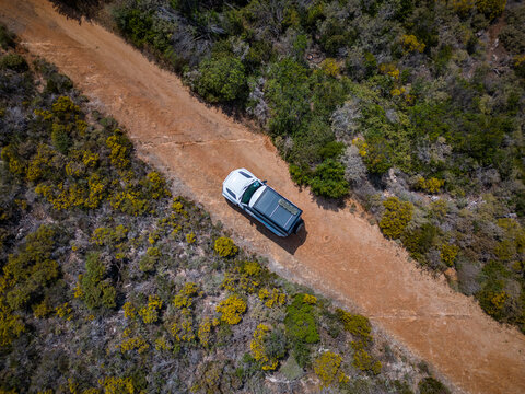 Off-Road Adventure in Greece &ndash; 4x4 Vehicle Driving on a Remote Dirt Track Through Mediterranean Landscape