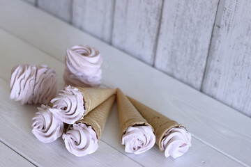 Zephyr in waffle cones. On boards painted white.