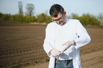 POV view of farmer owner control soil quality before seed plant. Future agriculture concept.