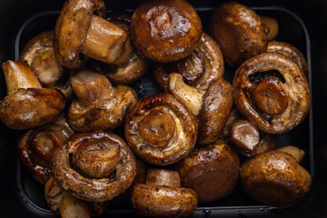 Delicious mushrooms in a black box. Delivery
