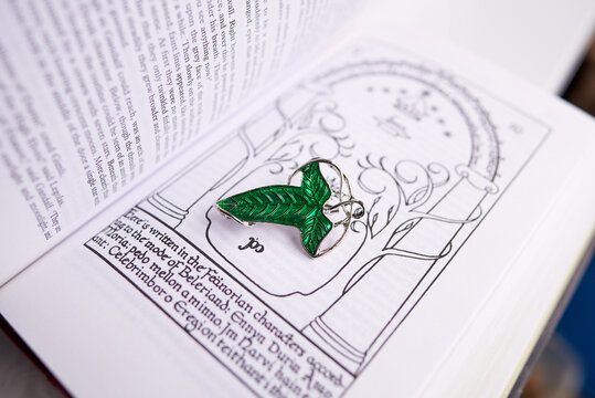 Astrakhan, Russia - 03.26.2021: Green brooch on Lord of the Rings book