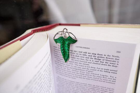 Astrakhan, Russia - 03.26.2021: Green brooch on Lord of the Rings book