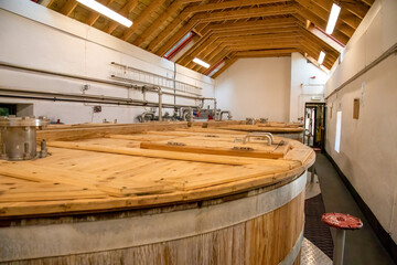 Wooden tanks which make up part of the distilling process of scottish whisky in a small distillery...