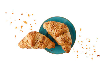 Fresh baked almond nuts croissants with crumbs on vintage blue green plate isolated on white background.