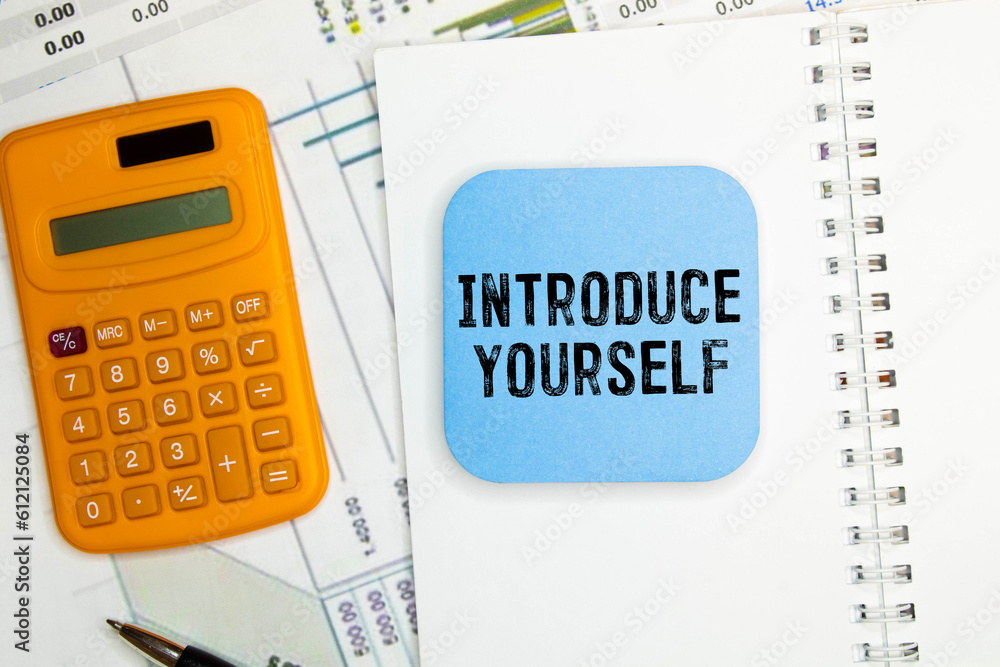 Poster sticky note with the text introduce yourself on office desk. self-introduction concept