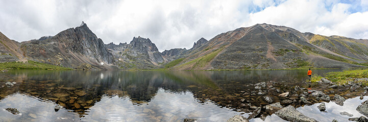Fototapeta na wymiar Panoramic mountain wilderness seen arctic Canada during summer time in Tombstone Territorial Park on Grizzly Lake hike expansive wild views panorama.