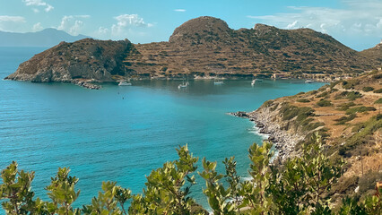 Girl is traveling in Turkey. View of lighthouse in ancient city of Knidos.