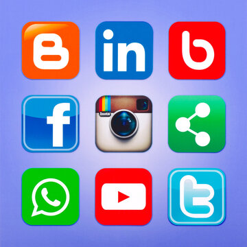 KIEV, UKRAINE - MAY 13, 2015:  Twitter, YouTube, WhatsApp, bebo, facebook ,linkedin, instagram, blogger and others logos printed on paper.