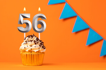 Candle number 56 - Cake birthday in orange background