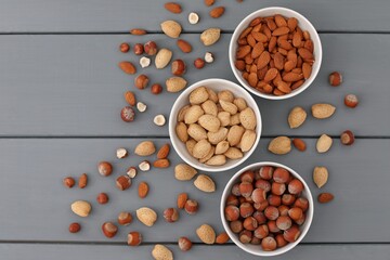 Nuts peeled and unpeeled, in shell, healthy food, on gray background, background image