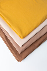 Knitted fabric of different colors, fabric on a white background.