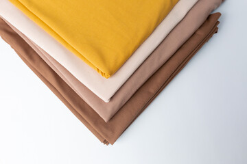 Knitted fabric of different colors, fabric on a white background.