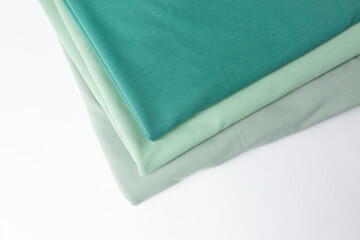 Knitted fabric of different colors, fabric on a white background.