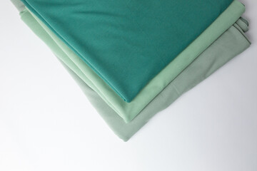 Knitted fabric of different colors, fabric on a white background.