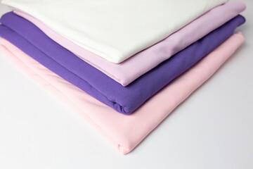 Knitted fabric of different colors, fabric on a white background.