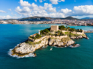 Fototapeta premium View from drone of Pigeon Island with medieval fort on Turkey's Aegean coast in Kusadasi