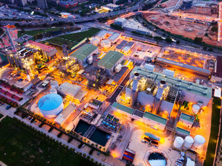 Aerial night view of power plant and waste treatment plant in Barcelona ..
