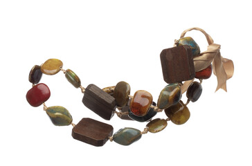 Stone rock bead style necklet fly in air. Green Brown color bead necklace as gemstone for fashion...