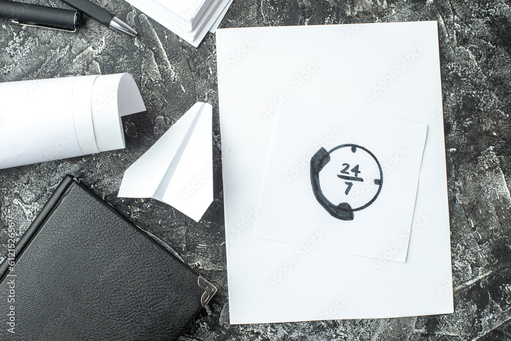 Wall mural overhead view of white sheet with call line drawing and notebook ruler pens blanks paper plane on gr