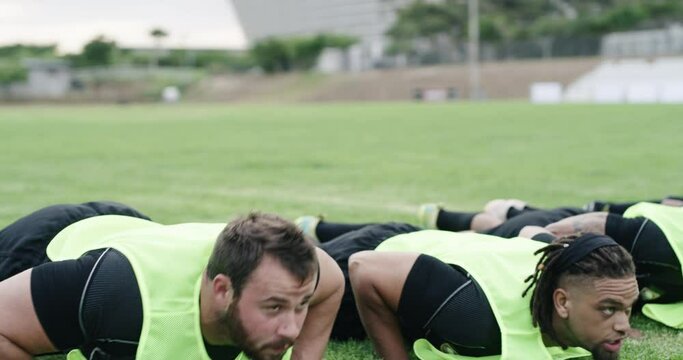 Sports, rugby training and coach with stopwatch for exercise, push up and warm up for practice. Fitness, teamwork and trainer time sport players workout for wellness, performance and cardio for game