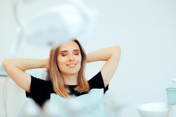 Happy Relaxed Patient Sitting in a Dental office. Carefree woman happy with the results after...