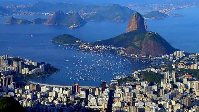 Aerial view of Guanabara Bay, mountain Sugar Loaf and Botafogo seen from Christ the Redeemer in summer afternoon, Rio De Janeiro, Brazil