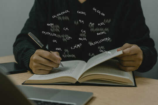 Man hand holding pen write structural formulae of chemical compounds icon on paper virtual screen. education science research knowledge concept. - Powered by Adobe