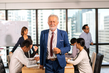 Portrait of smiling happy relax profile ceo handsome attractive confident senior businessman, eldery, fashionable, model, guy, creative old male look at camara enjoying standing at office