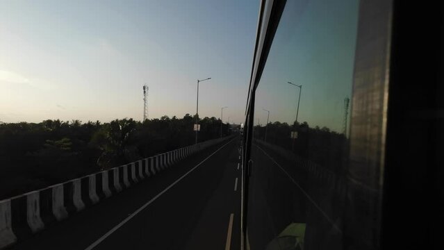 travelling mumbai to malvan wide view from bus window in evening sunset pov