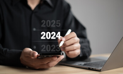 Businessman pointing year 2024. Business new year card concept.