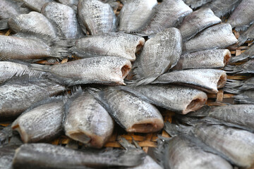 Dried fishes collocate on a pannier, in Thailand,