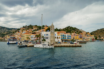 Symi, a beautiful small Greek island near Rhodes, which is visited by many tourists due to its colorful houses