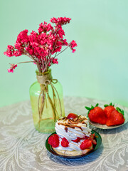 Homemade vanilla chocolate coffe mocha cake with a pastel tone and strawberry