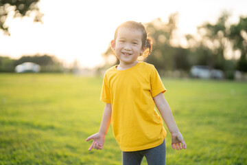 little asian girl exercise on the field