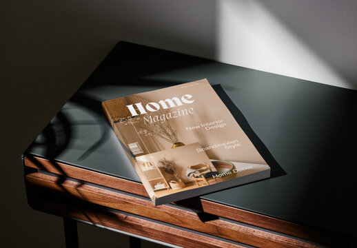 Mockup of closed US letter size magazine with customizable cover on small table