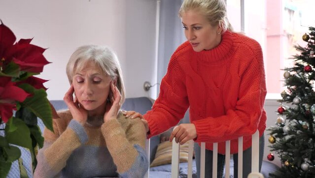 Domestic quarrel between an elderly mother and an adult daughter on Christmas holidays