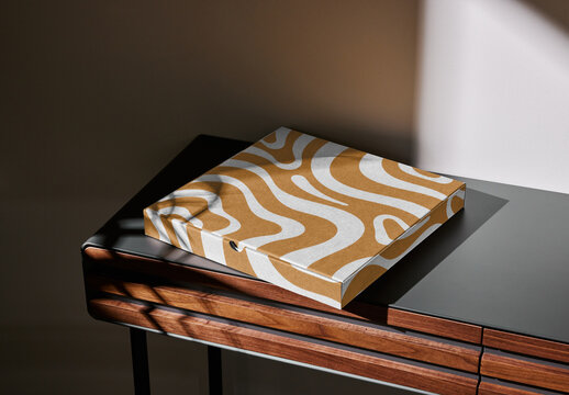 Mockup of customizable closed cardboard pizza box on small table