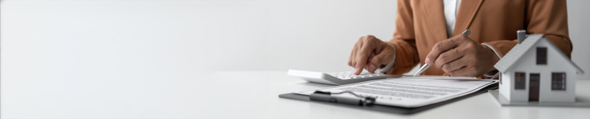 Obraz premium House and insurance contract signing with agents, business women, calculations, terms and conditions of house and real estate contract documents Business contract concept copy space, panorama, banner